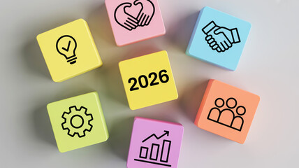 Colorful Blocks With Business Icons And Year 2026 Arranged On A Light Gray Surface image photo