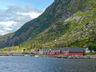 The row of classic Scandinavian red houses along the fjord shore