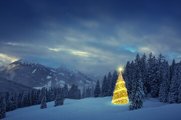 Christmas background with golden fir tree in a winter forest.