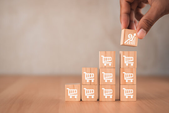 Increase e-commerce sales and business growth. Hands stacking wooden blocks with a shopping cart icon and a profit chart.