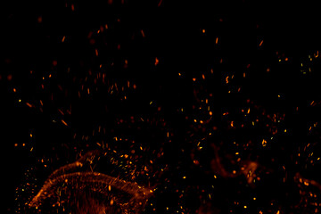 A black background with a lot of fire and smoke