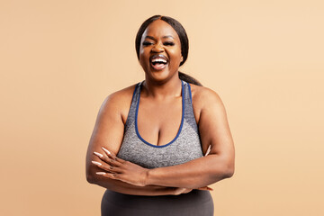 Black woman laughing showing body positivity