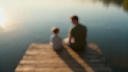 Fototapeta premium Blur image of Happiness of Asian young father and son sitting with talking together on a wooden bridge amid nature in the morning of spring holidays