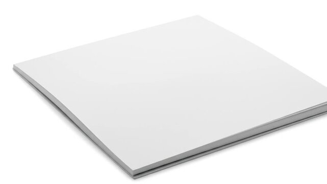 A partially visible, blank, square book, resting on a white background, featuring white pages with a gray edge