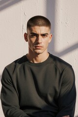 Obraz premium Young man with short hair and serious expression