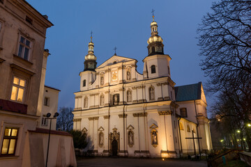 Illuminated historic Saint Bernard baroque church and monastery in Krakow, Poland