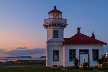 Victorian-style Mukilteo Lighthouse against dramatic sunset, Pacific Northwest coast, Washington state, USA