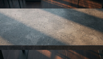 Close-up of a speckled concrete surface with dappled light.