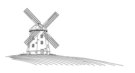 Fototapeta premium A picturesque vintage windmill stands majestically atop a gentle hill casting a long shadow on the grassy terrain beneath.