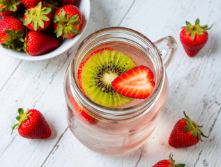 Refreshing strawberry and kiwi infused water in a mason jar