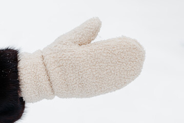 woman hand in white mitt, white snow, winter fun, winter background