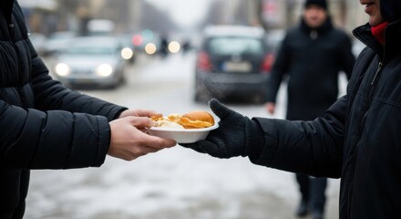 Hands exchanging food on snowy street - winter helping gesture