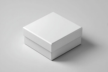 Simple white square gift box with lid on a plain light gray background. A clean, minimalist presentation of an empty white square box, perfect for product mockups and design concepts
