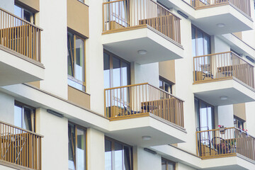 Modern residential building facade with balconies. Represents sustainable urban living, high-density housing, community lifestyle, real estate development, and affordable city accommodation.