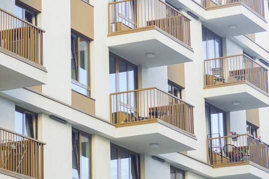 Modern residential building facade with balconies. Represents sustainable urban living, high-density housing, community lifestyle, real estate development, and affordable city accommodation.