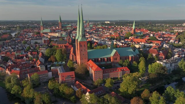 Lubeck city Aerial shot. Saint Marie and saint peter churches, Holstentor Gothic gate, Schleswig-Holstein land, Germany