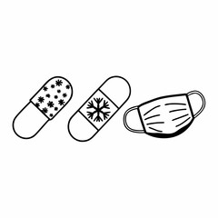 Bandages and a face mask with snowflake design