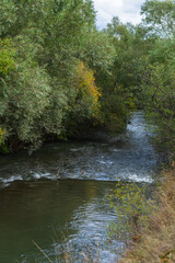 Autumn landmark with trees and Pambak river, Armenia