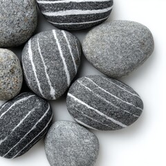 An array of striped rocks arranged in a natural pattern, showcasing their unique textures