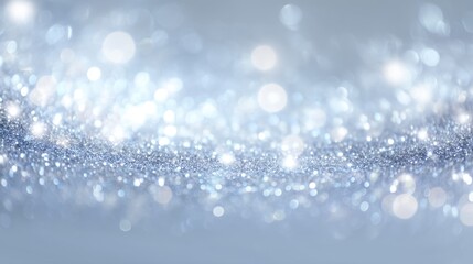A beautiful abstract image featuring a silver bokeh background with shimmering light effects. Ideal for creative projects and festive occasions.