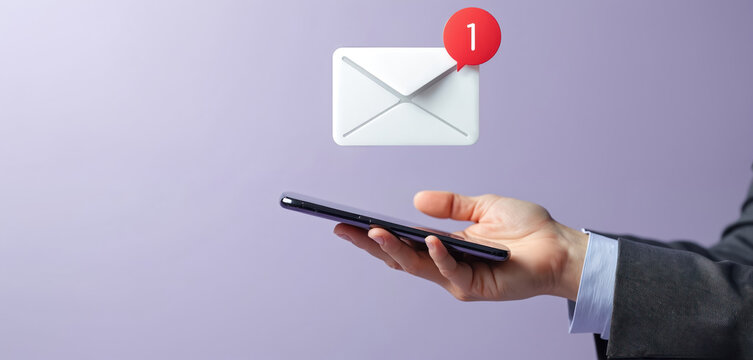 Businessman holds smartphone displaying email icon with notification. Focus on digital correspondence, secure messaging. Represents online communication protection against spam, unwanted messages.