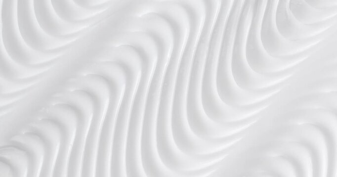 Cosmetic smears of creamy texture. Cosmetic skin cream. Beauty skincare product sample. Close-up footage of cream texture on rotating table