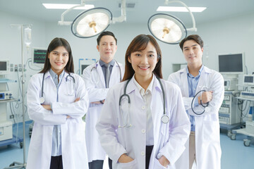 Medicine and healthcare concept : Group of happy and cheerful Asian doctors, Male and Female are smiling in Operating Room.