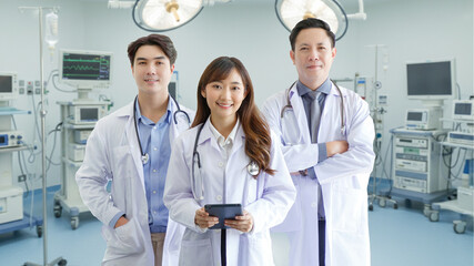 Medicine and healthcare concept : Group of happy and cheerful asian doctors Line up, Male and Female are smiling in Operating Room.