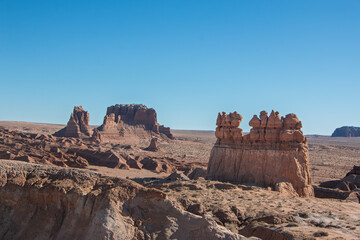 Molly's Castle, red rock formation under a clear blue sky, Goblin Valley State Park, Utah, USA.