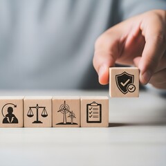 Hand places wooden block with shield and checkmark symbolizing security and compliance