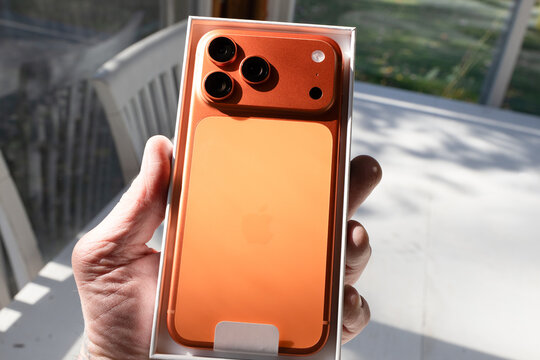 Iphone 17 Pro Max in cosmic orange is new and in packaging illustrating the sleek new design, color and new camera configuration of the latest model