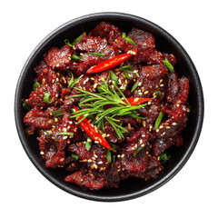 An overhead view of a savory bowl of spicy beef garnished with chili peppers sesame seeds and fresh green herbs presented in a dark bowl against a black backdrop
