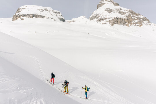 Skiers enjoy a backcountry tour in the Northern Rockies of British Columbia, Canada.