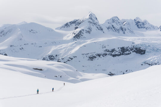 Skiers enjoy a backcountry tour in the Northern Rockies of British Columbia, Canada.