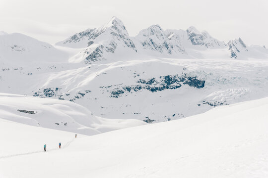 Skiers enjoy a backcountry tour in the Northern Rockies of British Columbia, Canada.