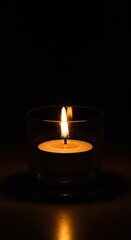 Gentle candlelight casts a warm, inviting glow from a votive holder, creating a peaceful and serene atmosphere for quiet moments ,wax ,holder ,quiet