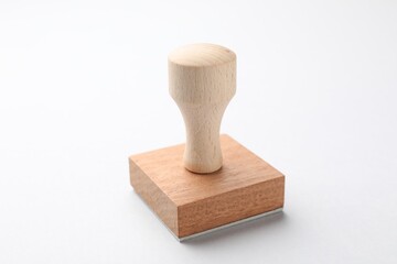 One wooden stamp on white background, closeup
