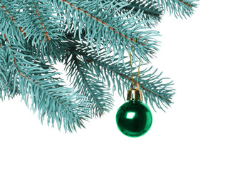 Christmas tree branch with decorative ball isolated on white