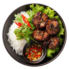 A delicious bowl of grilled pork with rice noodles fresh lettuce and a spicy dipping sauce viewed from above