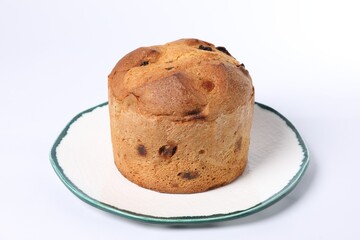 Christmas food. Delicious Panettone cake on white background, closeup