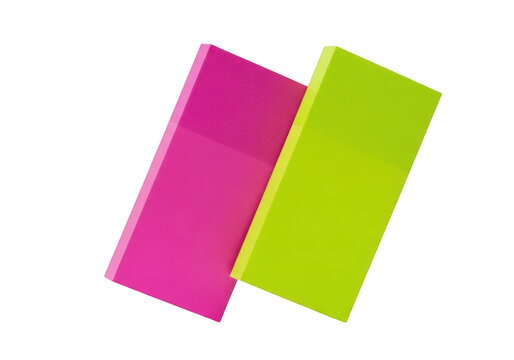 Neon pink and lime green rectangular rubber erasers for correcting pencil marks, isolated school and office supplies on white background.