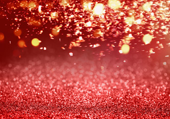 Christmas background with red glitters and bokeh lights