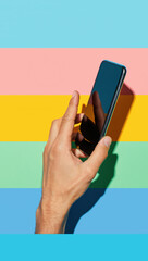 Mockup of male hand holding black frameless cell phone with blank screen isolated at white background.