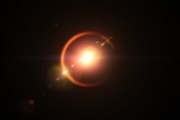 Motion graphics and VFX asset library for visual effects production. Lens flare on black background digital effect with golden orange glow circle