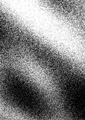 Abstract black and white texture showcasing a gradient of dots and speckles in an artistic arrangement