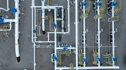 Aerial top view of natural gas pipeline high pressure pipes, 
Business natural gas industry, Construction natural gas transport system, Pipeline operation center.
