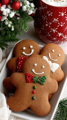 Fototapeta premium Delicious gingerbread cookies with festive decorations on a holiday table surrounded by seasonal greenery