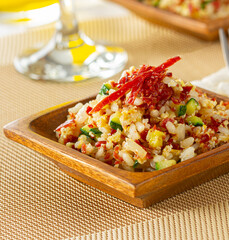 Rice cooked with vegetables and Iberian ham.