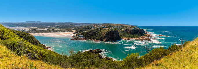 A panorama view from West Head headland across the strait towards Leisure Island and the rocky coastline on the Knysna river, South Africa in Springtime