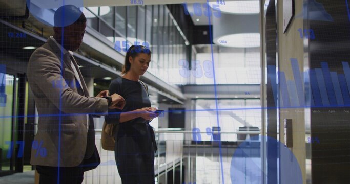 Co-workers checking watch and browsing phone near elevator panel in office with data overlay